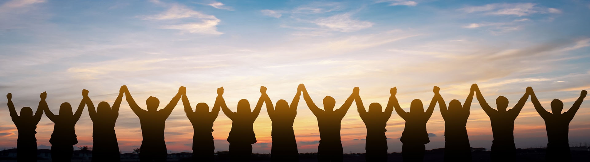 people raising and holding hands